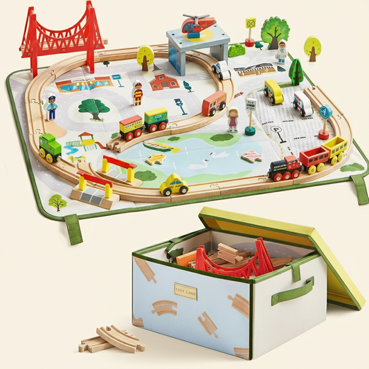 A 110-Piece Wooden Train Set with Fold-Out City Box featuring tracks and accessories on a city play mat, with a toy storage box in the foreground containing additional track pieces and a red bridge.