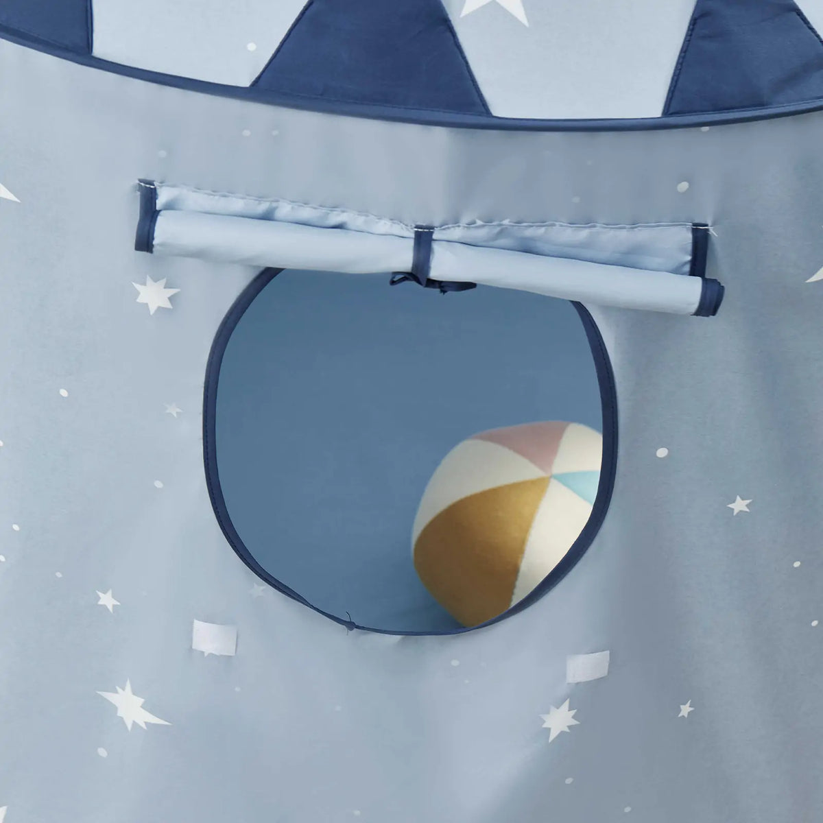 Starry Indoor Play Tent for Toddlers in blue with white stars, featuring a circular window with a rolled-up flap and a colorful ball inside.