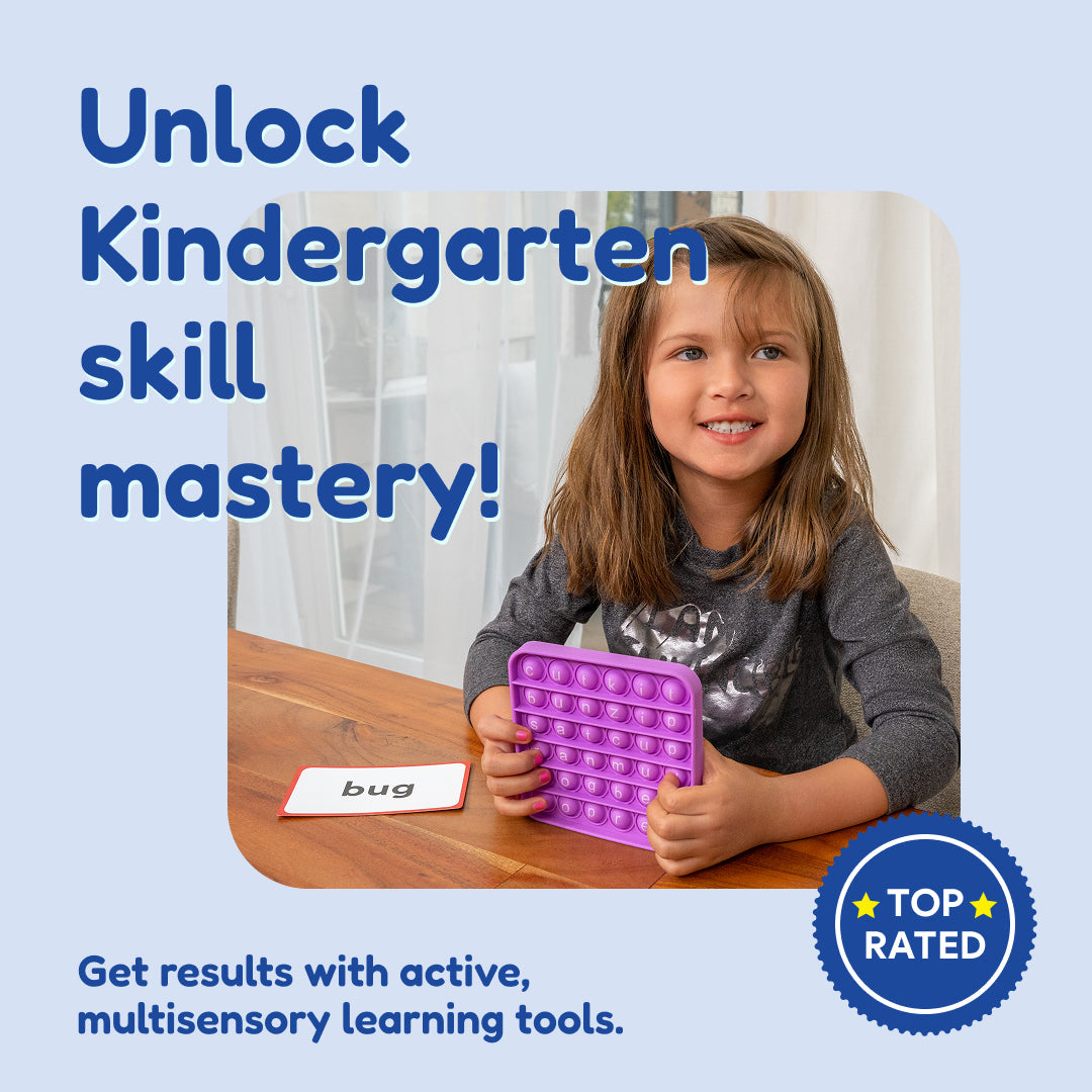 A smiling child sits at a table using a Kindergarten Readiness Backpack, holding a purple letter toy next to a bug flashcard.