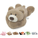 The Niuniu Daddy 20 Weighted Stuffed Animal in Bear color lies on its stomach, with six small plush toys—pink rabbit, brown sloth, brown bear, red panda, green dinosaur, and gray cat—resting underneath.
