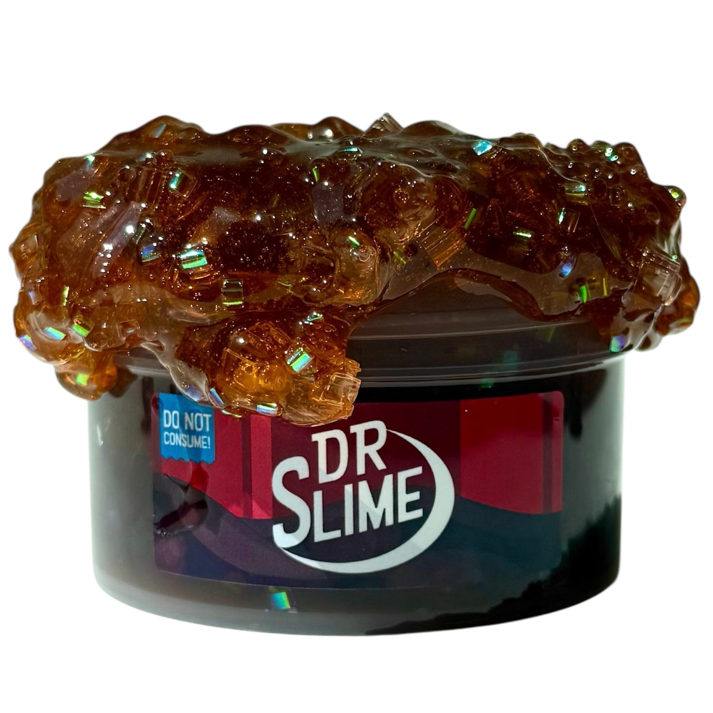 A 7 oz tub labeled Dr Slime Dr Pepper Scented Block Bead Bingsu Slime overflows with glossy, amber slime, shiny beads, and blocks. A warning label says: Do Not Consume. The coated texture delivers a long-lasting Dr Pepper aroma.