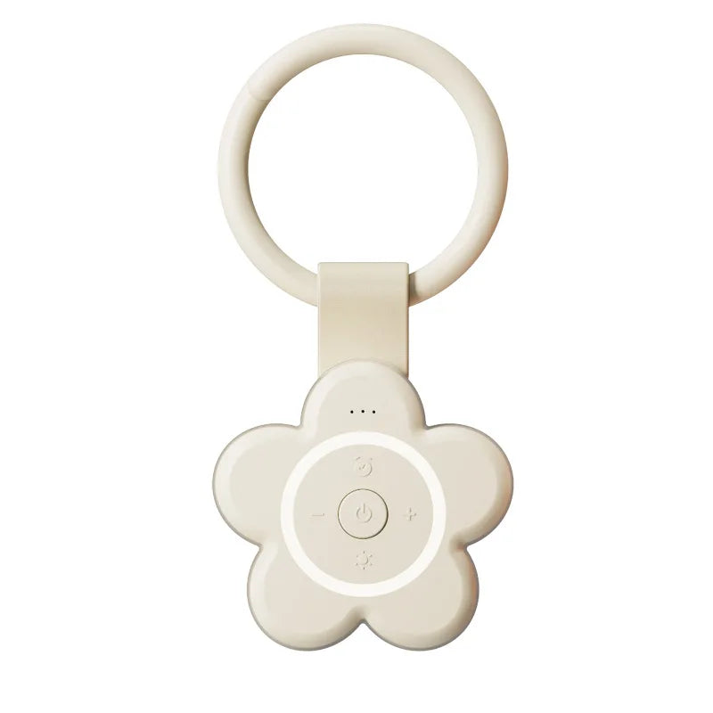 The beige Portable Newborn Baby Sleeping Gadgets White Noise Device is a flower-shaped sound machine with a ring handle and central buttons for power, brightness, and volume—perfect for soothing babies or adults anywhere.