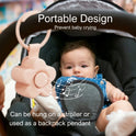 A baby sits in a stroller with the Portable Newborn Baby Sleeping Gadgets White Noise Device, a flower-shaped sound machine attached to the handle, ideal for soothing and calming babies anywhere with gentle white noise.