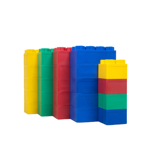 The Jumbo Building Blocks 24 PC - Beginner Set is arranged in four stacks—yellow, green, red, and a multicolored stack—displayed in a row on a white background.