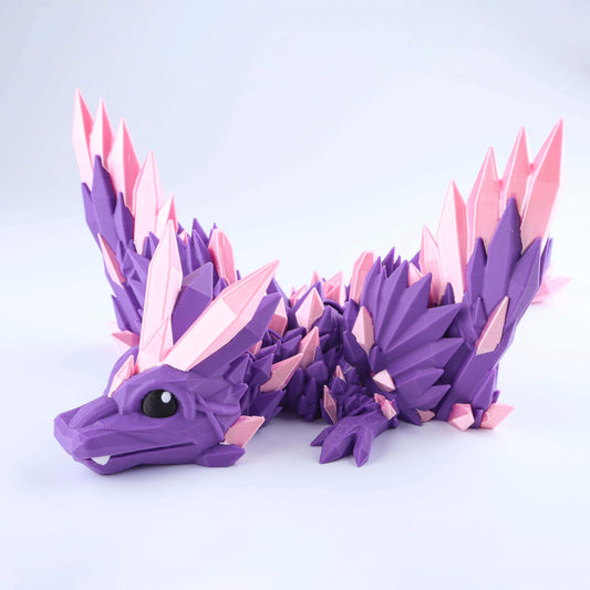 A Crystal Wing Baby Dragon – Poseable Fidget (6″), a purple poseable baby dragon toy with pink crystal spikes on its wings and back.