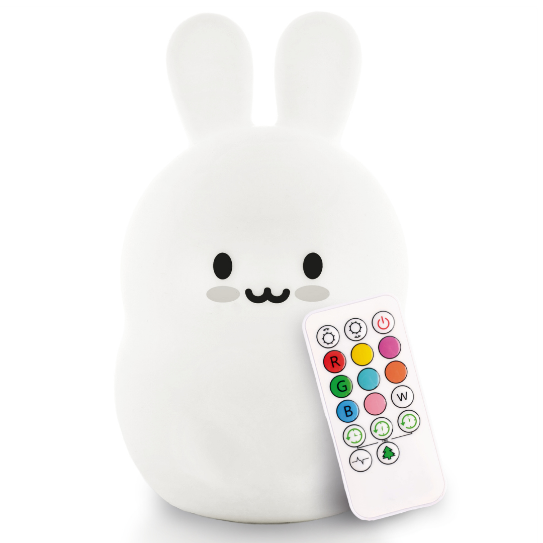 Baxter the Bunny Silicone Night Light, a white silicone bunny accompanied by a small remote control with colored buttons, acting as the perfect bedtime buddy.