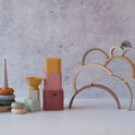 The Stack Happy Trio – Montessori Stacking Set includes a stacking ring tower, nesting blocks, a bowl, and an arched silicone stacker.