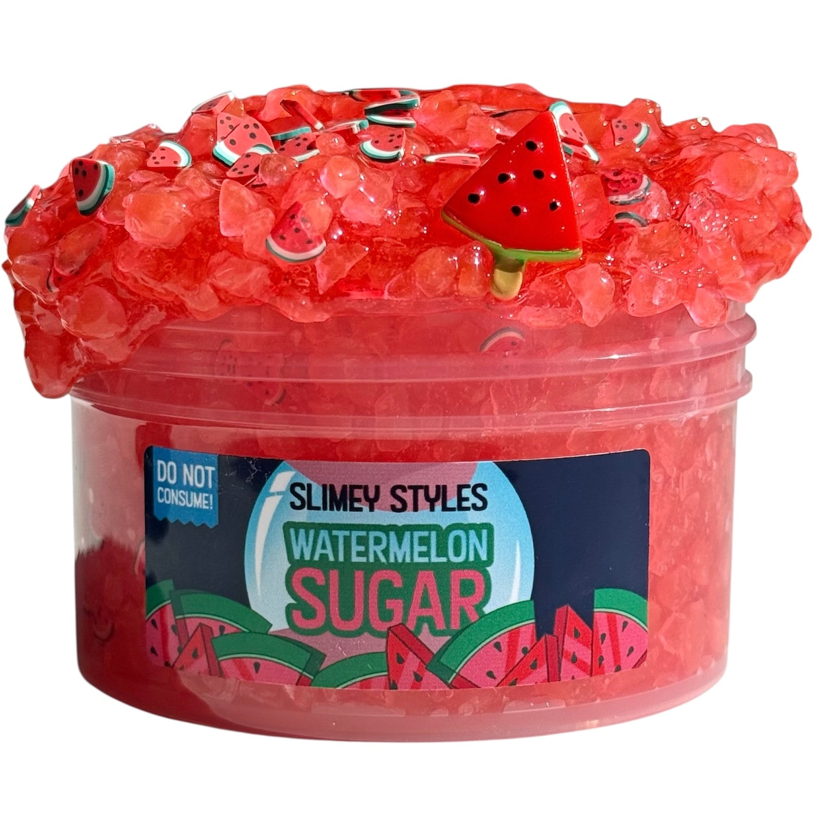 The 7oz Watermelon Sugar Red Silica Bead Slime is scented like Watermelon Jolly Rancher and topped with watermelon sprinkles and a popsicle charm. Includes a "DO NOT CONSUME!" warning on the label.