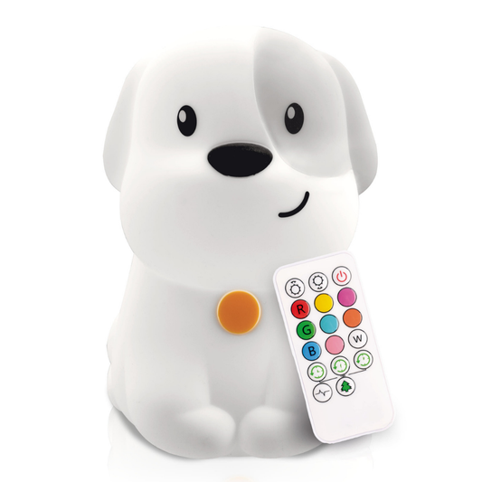 A white Pepper the Puppy Silicone Night Light sits next to a remote control with colorful light setting buttons.