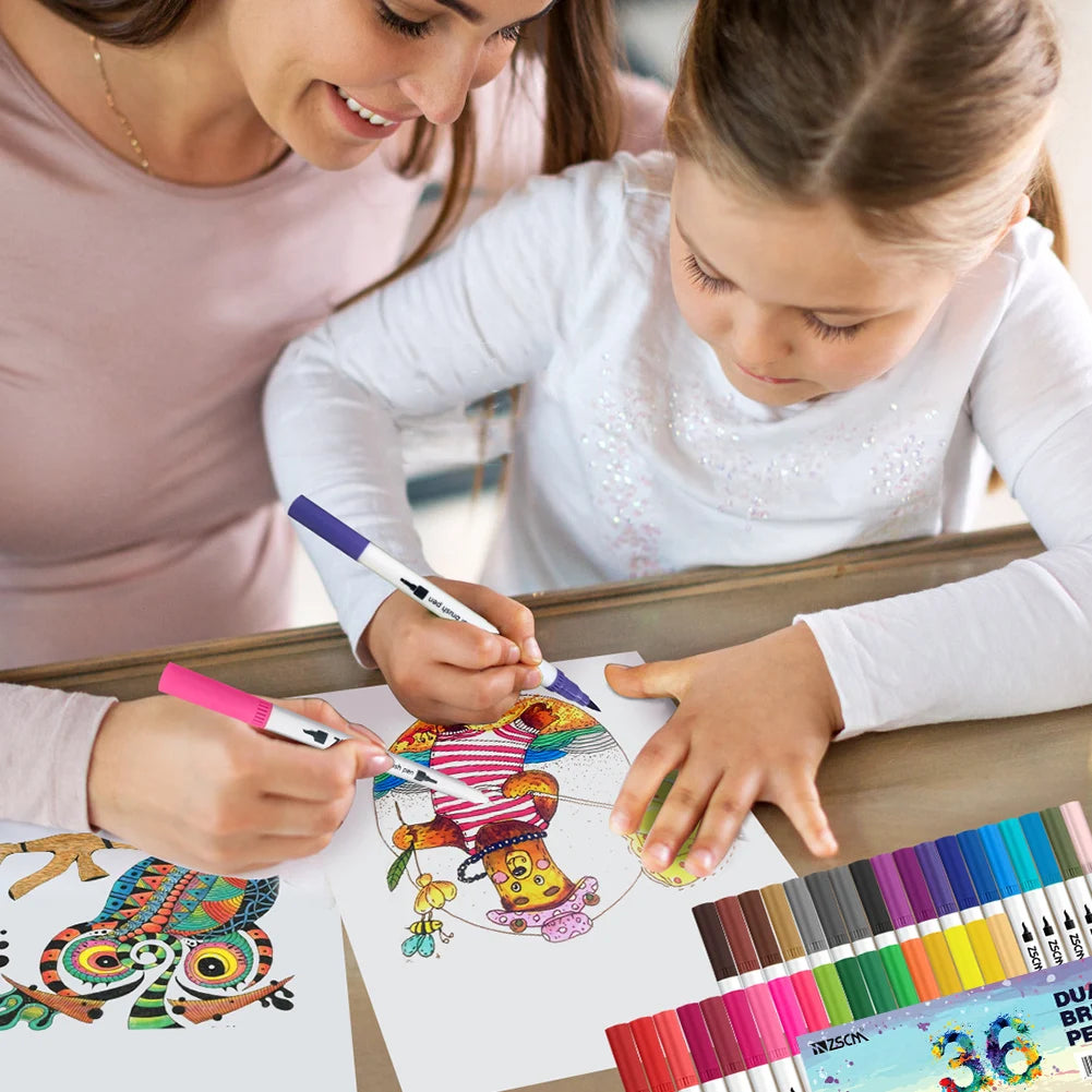 A woman and a child color owl-themed drawings at a table with the Vibrant Dual Tip Brush Pen Marker Set. The child uses pink while the woman chooses purple, and an extensive range of markers from 12 to 160 colors enhances their vibrant creative session.