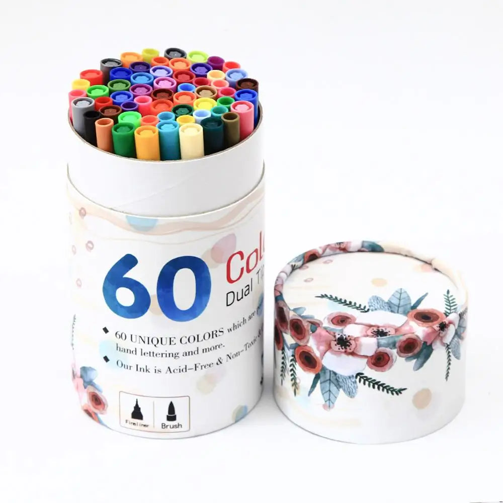 A lidless cylindrical container showcases the Vibrant Dual Tip Brush Pen Marker Set, label reading 60 Colors Dual. The floral lid design, with red and pink flowers amid green leaves, enhances the elegance of this pen set for creative drawing and sketching.