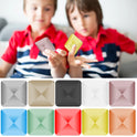 Two children in red shirts play with VKTECH Plastic Desk Toy Kinetic Skill Fidget Spinners. Below, ten colorful toys—including gray, black, white, pink, yellow, green, and blue—are shown. Made in Mainland China.