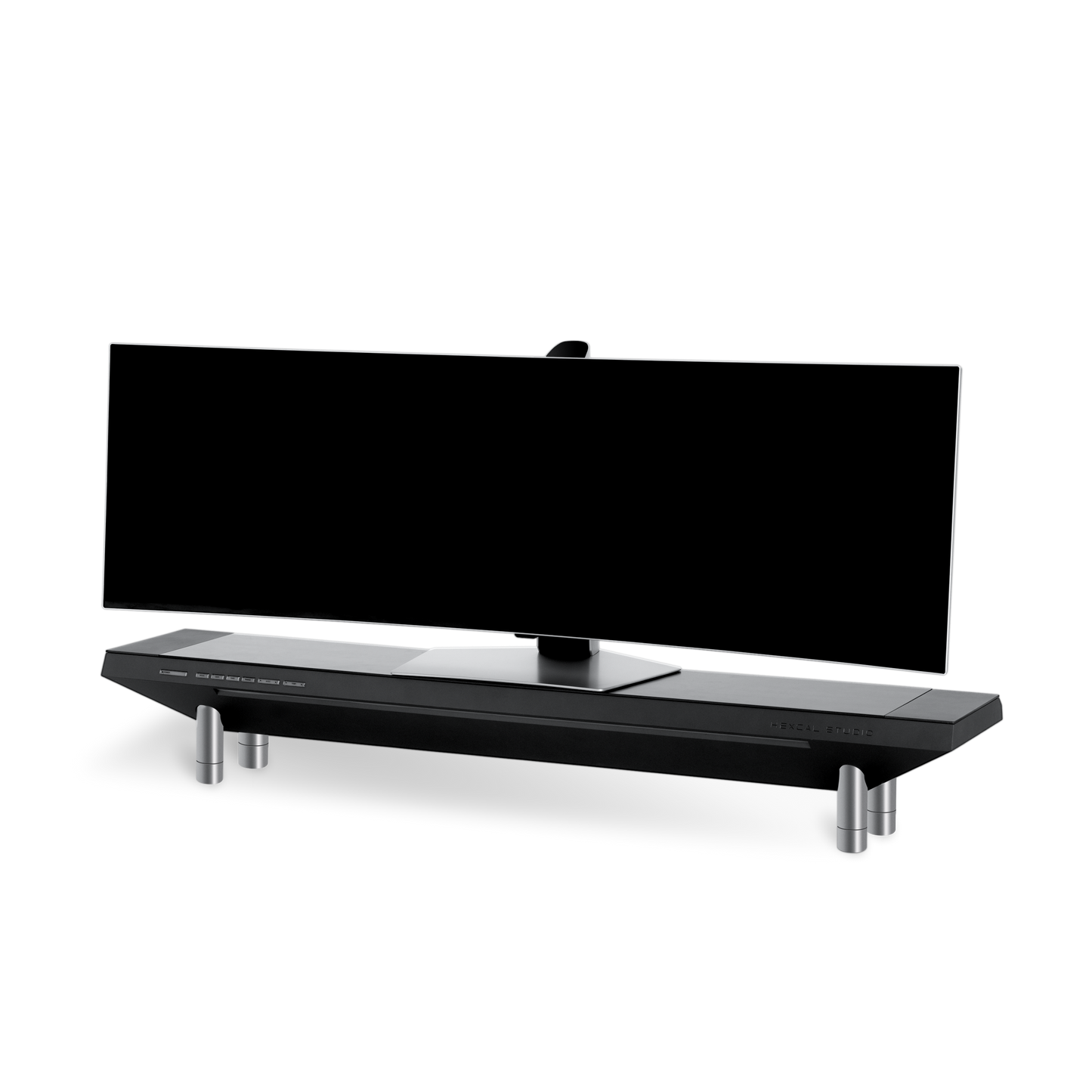 The Hexcal Studio™ is a wide, curved black monitor with a sleek, angular adjustable stand on four metallic cylindrical legs, displayed against a plain white background.