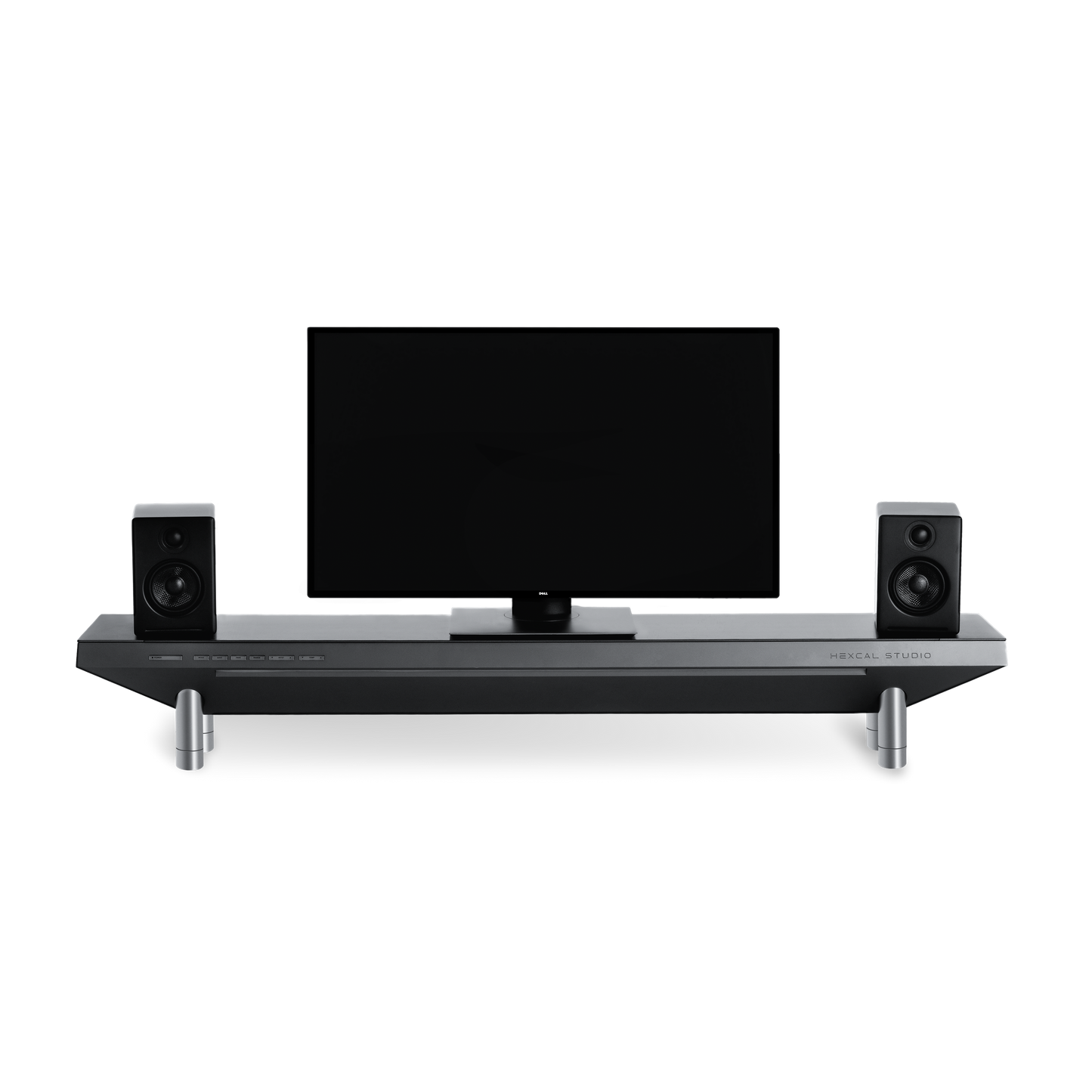 The Hexcal Studio™ is a modern home entertainment setup with a flat-screen TV, black speakers, and a sleek soundbar shelf with metallic legs and built-in cable management, all shown against a plain white background.