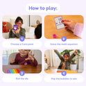 Four-step guide for children playing learning games with a Math Card Pack Bundle (Multiplication + Division), a die, and a bubble-popping fidget toy.