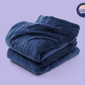 A folded navy Gravity Original Weighted Blanket (10–25 lb) with a quilted grid pattern, breathable cover, and a circular badge that reads Sleep Score Validated.