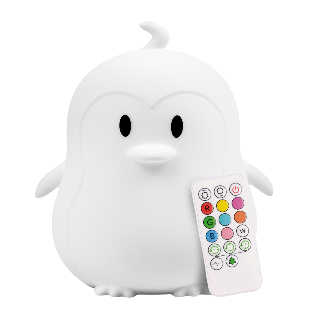 A white, penguin-shaped Pebbles the Penguin Silicone Night Light with an accompanying remote control featuring colorful buttons for light settings.