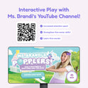A screen displays a video of a woman pointing to the Popplers: Daily Routines & Feelings Toddler Game title next to a QR code highlighting benefits like increased attention span, fine motor skills, and learning words.