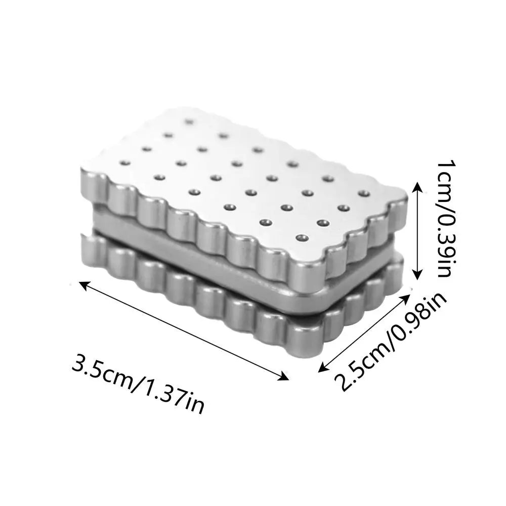 The Biscuits Fidget Slider is a biscuit-shaped, rustproof sensory desk toy (3.5×2.5×1 cm) with wavy edges and a dotted top, labeled in cm/inch. Made in China; color as shown—perfect for kids or as an executive haptic fidget toy.