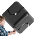 A young child in a plaid shirt holds a large, glossy black Infinity Gear Cube Spinner Antistress Toy with curved grooves, isolated on a white background.