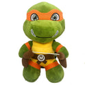 A 25cm Ninja Turtles Plush Doll featuring Michelangelo in green with an orange mask, wrist and knee bands, brown belt with M emblem, and plush nunchaku—ideal for kids birthday gifts and TMNT fans.