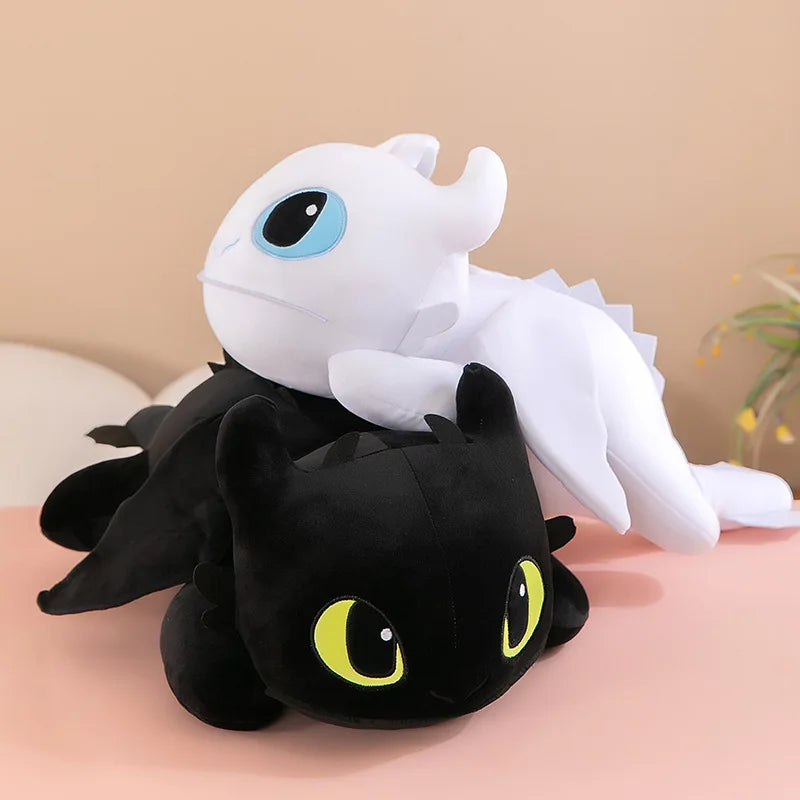 Two 30cm/40cm plush dragon toys, one white and one black, are stacked on a light surface. Each features soft PP cotton filling and is inspired by Kawaii dinosaur characters—ideal plush gifts for boys and girls birthdays.