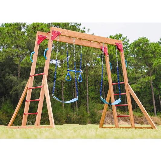 The Wood Swing Sets for Backyard with Monkey Bar Playset features two blue swings, gymnastic rings, red handles, ladders on both sides, and monkey bars—perfect outdoor play equipment for kids to enjoy among trees and grass.