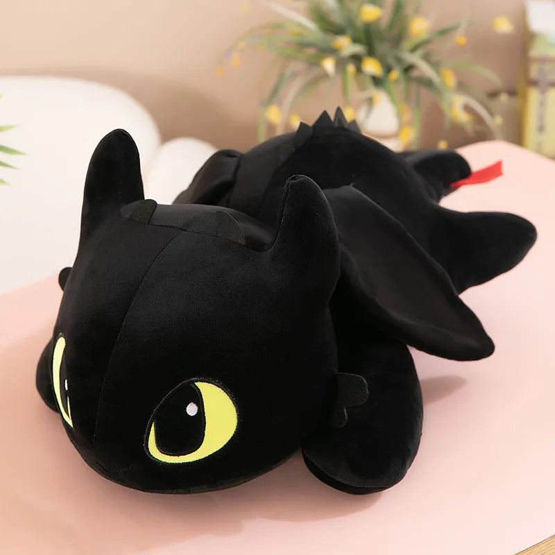 The 30cm 40cm black Plush Dragon Toy is a cute stuffed animal and birthday gift for boys and girls. Made with soft PP cotton, this kawaii dinosaur plush features big yellow-green eyes and is perfect as a comfy cushion.