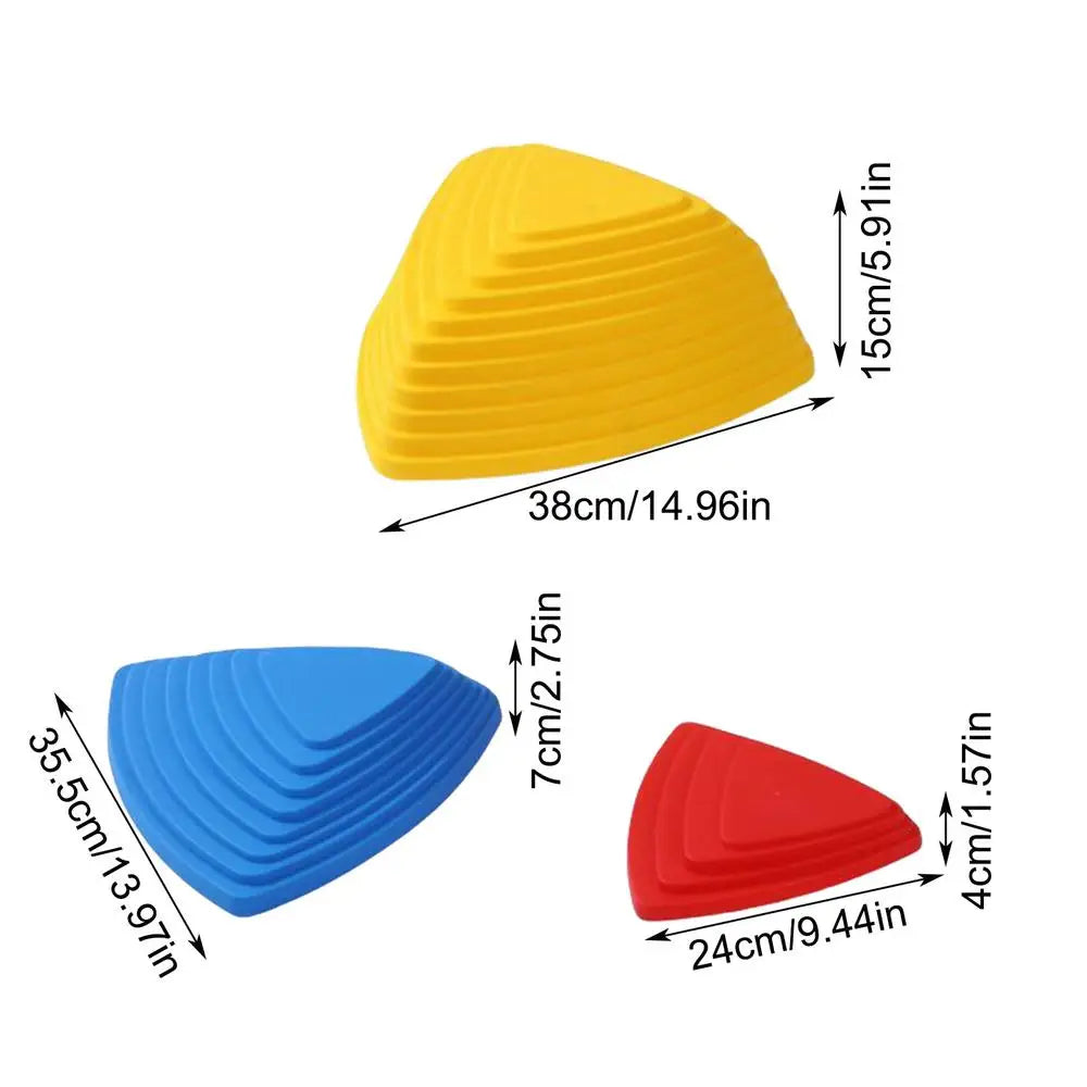 Three colorful triangular stones of varying sizes and heights are shown: the largest is yellow, medium blue, and smallest red. The Kids Balance River Stones set includes 5 non-slip sensory toys perfect for obstacle courses, enhancing play and coordination skills.