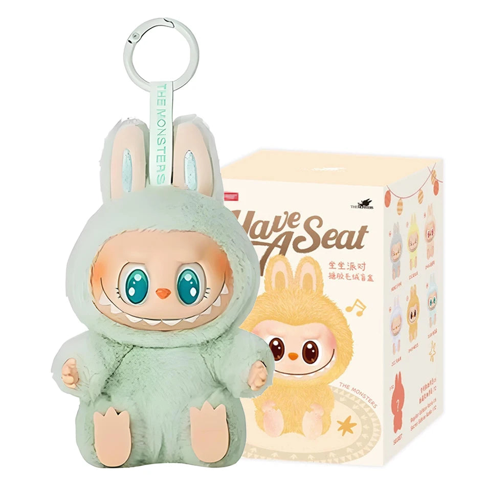 A MINISO Cute Labubu The Monsters Box Toy Sweetheart Vinyl Doll Keychain in Style A with box, featuring bunny ears, mint green fur, a big smile, and matching packaging with the characters illustration.