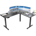 The Electric Height Adjustable 63 x 55 Inch Corner Stand Up Desk features three monitors, a keyboard, mouse, smartphone, coffee cup, headphones, stationery, and a potted plant—all arranged for a clean and organized workspace.