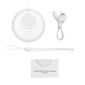 A 10 Songs White Noise Sound Machine Portable Baby Sleep Machine with soothing sounds, five buttons, USB charging cable, wrist strap, and user manual is shown on a white background. Volume adjustable and built-in rechargeable battery included.
