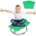 A smiling boy sits cross-legged on a green Playful Elephant Spin Sensory Chair, perfect for balance and coordination, with arms outstretched. Hes wearing a white t-shirt and jeans. Above is an illustration of the chair design.