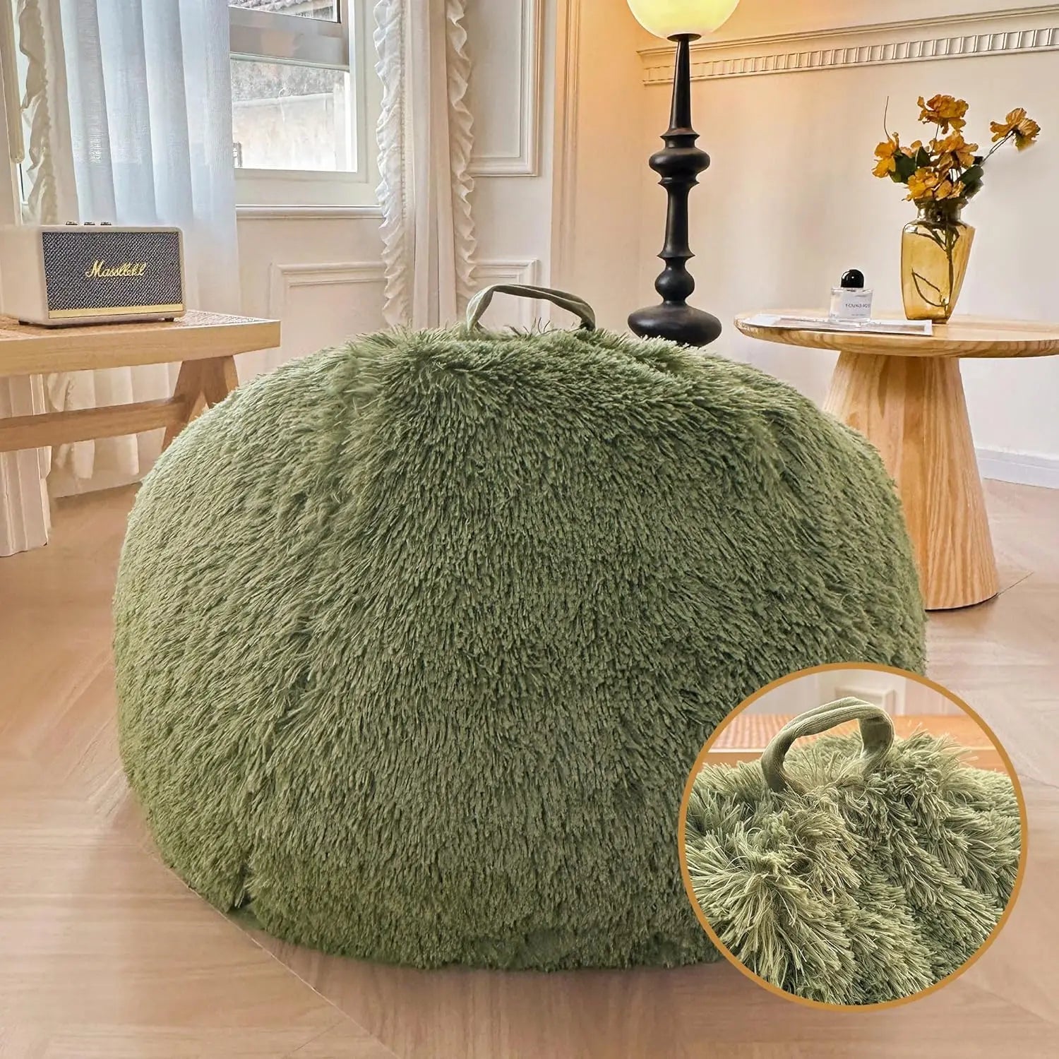 A green Faux Fur Comfy Bean Bag Cover No Filler Storage Chair with a top handle sits in a cozy living room; an inset highlights the plush texture and handle. In the background, there’s a lamp, table, flowers, and a window.
