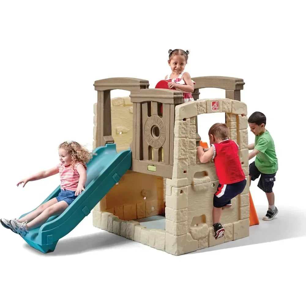 Four children play on the brown Woodland Climber II Kids Playset for ages 2 to 6. One girl slides down the teal toddler slide, another stands on top, and two boys climb up orange steps, all enjoying outdoor fun.