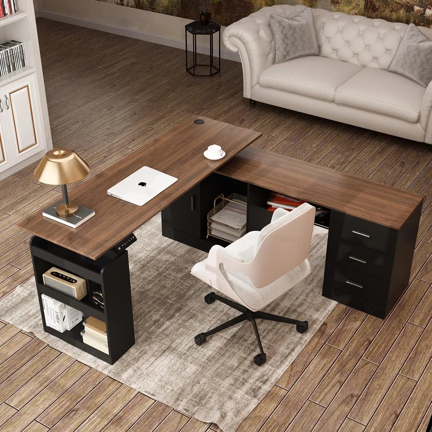 The L Shaped Electric Standing Desk with Drawers and Shelves, paired with an office chair, laptop, lamp, and books on a light rug in a home office with beige sofa and wooden flooring, features an industrial-grade steel frame for durability.
