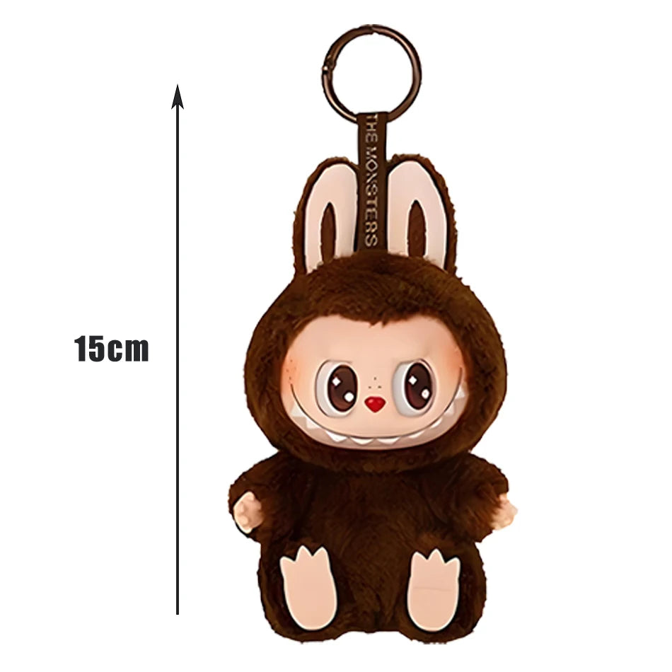 The Cute Labubu The Monsters Box Toy Sweetheart Vinyl Doll is a 15 cm plush keychain with big eyes, fangs, and a furry bunny costume. This MINISO exclusive has a top ring to easily attach to your backpack or keys.