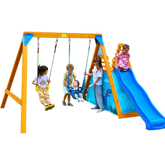 Five children enjoy the Playground Swing Sets for Backyard, a wooden playset with 2 swings, a big wave slide, and climbing wall; two swing, one is pushed by a friend, while two stand near the colorful slide.