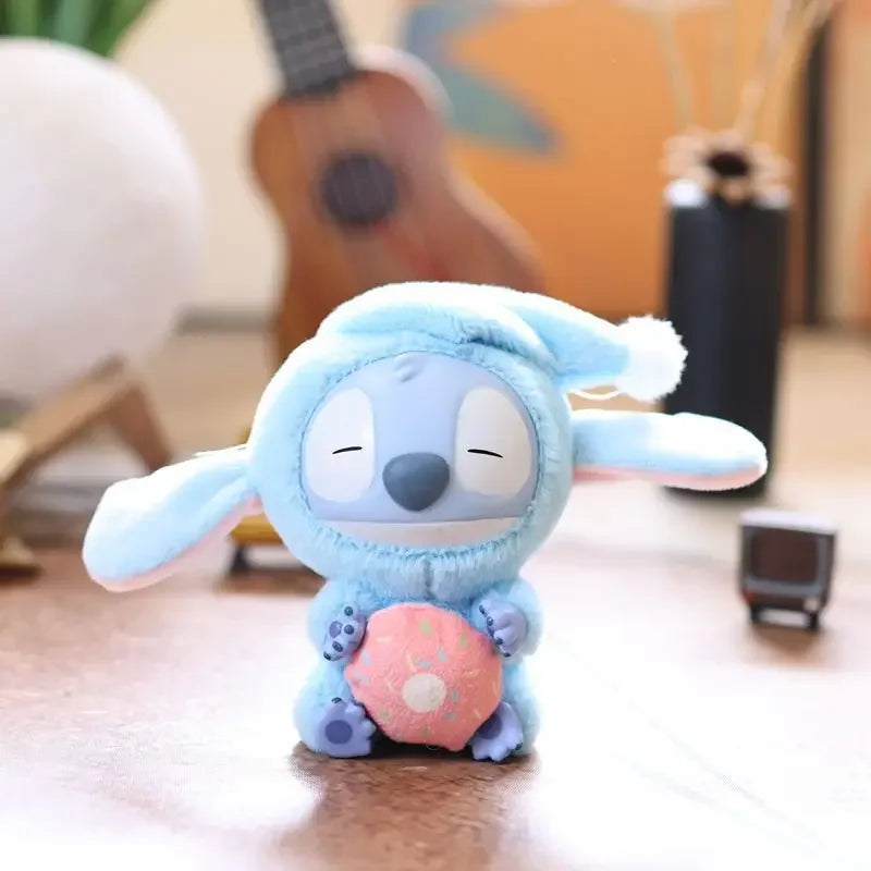 The Kawaii Accessories Stitch Plush Toy (Color: D) from the Eat Something Before Sleep Series is a cute Lilo & Stitch keychain and backpack pendant for girls, featuring Stitch in a blue bunny outfit holding a pink donut.