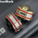 Close-up of two metallic Ammo Cracker Unzip Roller Fidget Toy Stress Relief Slider EDC Tools with orange stripes and engraved InsWork and AMMO text, designed for stress relief on a dark surface.
