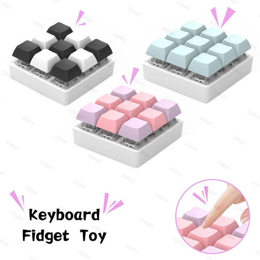 Three mini keyboard key toys, each with nine large keys in black/white, blue/white, and pink. A finger presses a key for stress relief. Text reads: 9 Keys Keyboard Key Toy DIY Fidget Button Keycap Stress Relief Finger Keyboard Keychain.