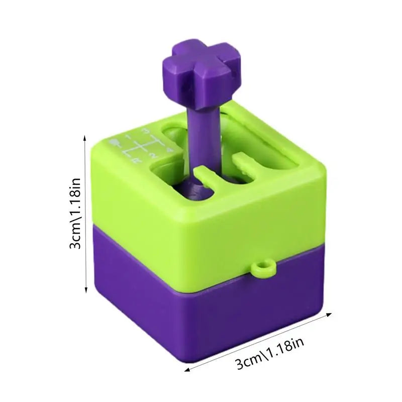 The MINOCOOL Manual Gear Shifter Keychain is a small, square 3D printed fidget toy (3x3x3 cm), green and purple plastic with a cross joystick. Designed for ages 14+, made in China. Measurements are shown on the image sides.