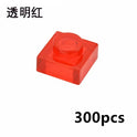 A transparent red MOC Bulk Brick Set includes 1x1, 1x2, 1x4, and 2x4 clear building block parts compatible with Lego—ideal for houses or wall panels. Chinese characters are in the top left and “300pcs” is in the bottom right.
