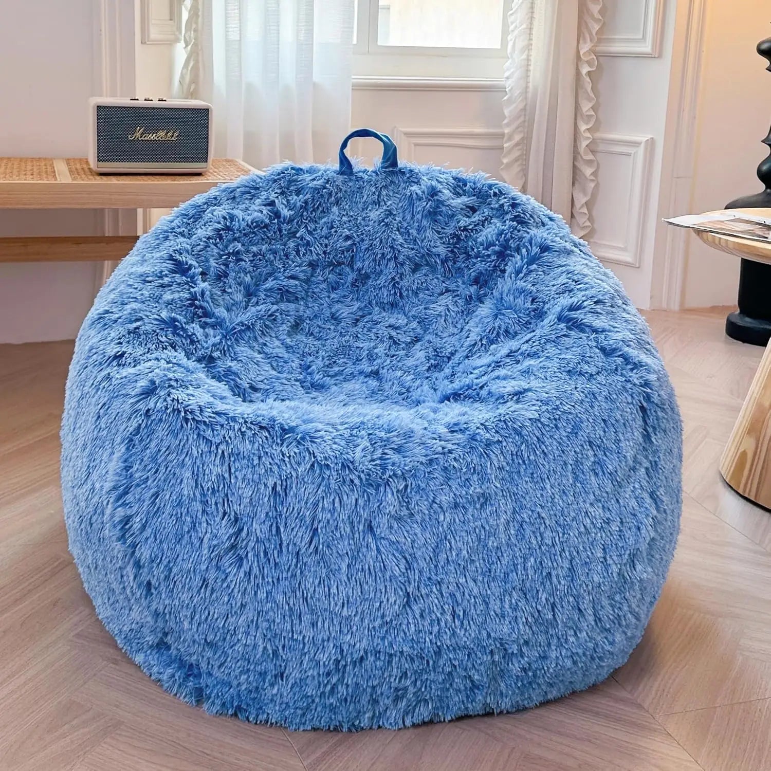 The Ombre Cobalt Blue Faux Fur Comfy Bean Bag Cover (No Filler) adds a cozy touch to your room, featuring plush fabric and a handy top handle for easy moving—perfect for stylish, comfortable seating or storage.