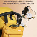 The Portable Sleep Aid Device for Baby, featuring 10 soothing sounds and a creative night light, hangs from a yellow stroller handle by lanyard—showcasing its comfort and portability for crib or travel use.