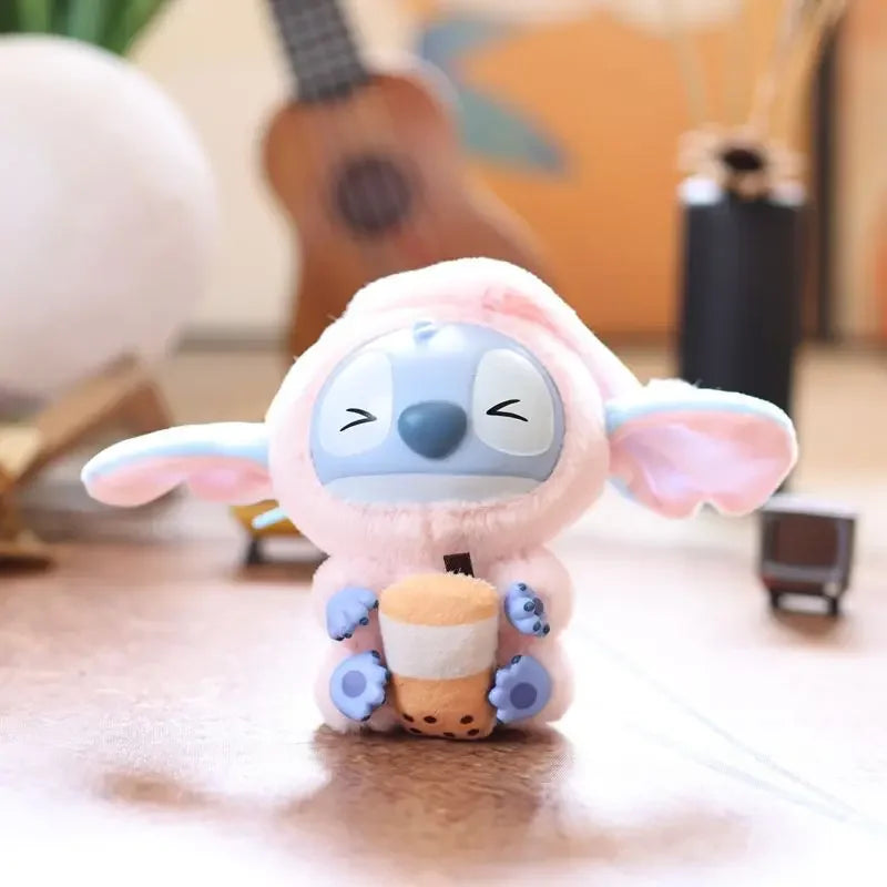 The Kawaii Accessories Stitch Plush Toy Lilo and Stitch Keychain features Stitch in a pink bunny outfit with a cup and cookie—an adorable backpack pendant or keyring for girls, perfect for fans of the Eat Something Before Sleep series. Color: A.
