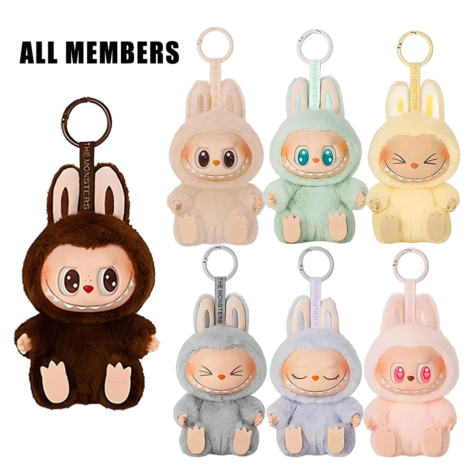 Seven Cute Labubu The Monsters Box Toy plush keychains in animal costumes, with big eyes and bunny ears, are displayed—six in two rows and a larger dark brown one on the left. Text: “ALL MEMBERS.” Suitable as backpack pendant or decoration gifts.