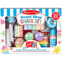 The Melissa and Doug Sweet Shop Multicolored Chalk and Holders Play Set includes 33 colorful chalk pieces, holders, stencils, and accessories, presented with playful candy and dessert-themed graphics. Great gift for kids.