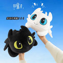 Two hands hold up 30cm and 40cm Plush Dragon Toys—kawaii white and black dinosaur plushies with PP cotton filling—perfect birthday gifts for boys and girls, shown against a blue background with playful cartoon accents and Chinese text.