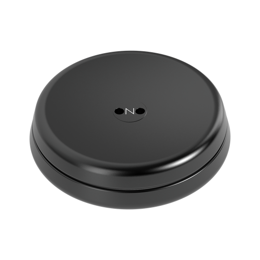 The ONO Slider Aluminum in Midnight is a smooth, round, black disk with two small holes and an embossed “ON” logo at the center—ideal as a calming fidget toy or a magnetized addition to your ONO Slider collection.